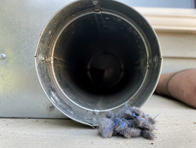 Rowland Heights Dryer Vent Cleaning technician using specialized equipment to clear severe dryer vent blockage in Rowland Heights